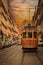 Orange tram in the street of Lisbon in Portugal