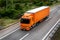 Orange Transportation Truck on road