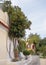 Orange tree on the narrow street of the Anafiotika district near the Acropolis in the city of Athens, Greece