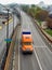 Orange truck on the road overpass