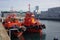 Orange tugboats waiting for job in port of Vigo, Vigo, Galicia,