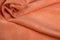 Orange twisted fabric close-up