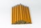 Orange, unsharpend pencils neatly stacked in a pyramid