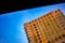 Orange urban cityscape buildings against blue sky