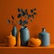 orange vase on the orange background exudes warmth and energy, while the touch of gray adds a subtle hint of sophistication