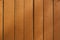 Orange vertical wooden laths, background, texture
