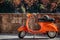 Orange Vespa byke