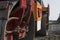 Orange Vibration roller compactor standing on a ground near asphalts road at road construction and repairing asphalt