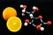Orange and vitamin C structure model (Ascorbic acid)
