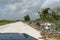 Orange Walk, Belize - May 21, 2017: Trash dumped next to road - highlights the issue of roadside garbage disposal in Latin America