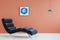 Orange wall and blue couch