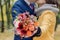 Orange wedding bouquet in hands