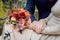 Orange wedding bouquet in hands