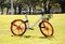 Orange wheels bicycle `Mobike bike sharing` is dockless system uses a smartphone app to unlock bicycles, charging an hourly rate