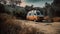 Orange and white camper van is parked on a dirt road in the middle of a wooded area