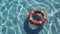 Orange and white lifebuoy floating on clear blue swimming pool water,