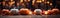 Orange and white pumpkins, candles and fall leaves decorated wood surface with lights behind banner - generative AI