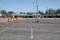 Orange and white pylons lined up in a parking lot