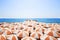 Orange white sun umbrellas on a beach at south french coast