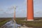 orange wind turbines on the dutch island of flevoland near Almere