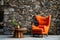 Orange wingback lounge chair and wooden coffee table against wild stone cladding wall