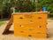 Orange wooden climbing wall ladder on kids playground