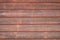 A orange wooden wall with a lot of texture from an hold small house. For any kind of background, wallpapers and desingns.