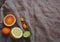 Orange yellow lemon green lime and spice herbs on brown rustic raw sackcloth fabric photo. A4 A5 international paper slide poster