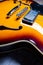 Orange and yellow semihollow electric guitar
