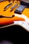 Orange and yellow semihollow electric guitar