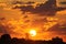 Orange and Yellowish Sunset Over Water Tower