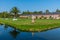 Orangerie and surrounding garden at Schwetzingen palace in Germany during sunny summer day