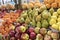 Oranges, apples, pears, pineapple, pomegranate, pumpkin, persimmonlie on the market counter for sale