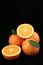 Oranges on black background