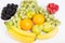 Oranges Blackberries Raspberries Grapes Bananas and Pears on White