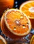 Oranges cut in half with water droplets on surface Close up macro photography of citrus Slices of Orange with splash of waterdrop