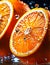 Oranges cut in half with water droplets on surface Close up macro photography of citrus Slices of Orange with splash of waterdrop