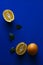 Oranges with green leaves on blue background, minimalist photography
