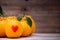 Oranges have a red heart-shaped put on the wooden table