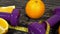 Oranges, juice, dumbbells and measuring tape on wooden background.