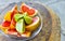 Oranges limes grapes lemon citrus grapefruit fruits on plate Mexico