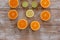 Oranges,limes and lemons slides on wooden table view from above.Beautiful background with fresh fruit half cut.Healthy eating