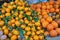 Oranges and mandarins on a street market display