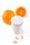 Oranges, vitamin pills and container isolated