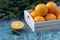 Oranges in a wooden tray with spruce branches. Christmas New Year holiday decorations Mandarin Orange Fruit Wooden background