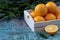 Oranges in a wooden tray with spruce branches. Christmas New Year holiday decorations Mandarin Orange Fruit Wooden background