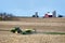 ORANGEVILLE, ILLINOIS - May 2,2020: John Deere tractor and planter at work with distant farm scene