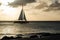 Oranjestad, Aruba - April 10, 2018: sailing in a sailboat near Eagle Beach at sunset