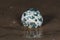 Orbicular Ocean Jasper sphere with crystallized vugs from Madagascar on wet sand  in front of the lake at sunrise