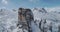 Orbit aerial around majestic Cinque Torri rocky snow mounts. Sunny day with cloudy sky.Winter Dolomites Italian Alps